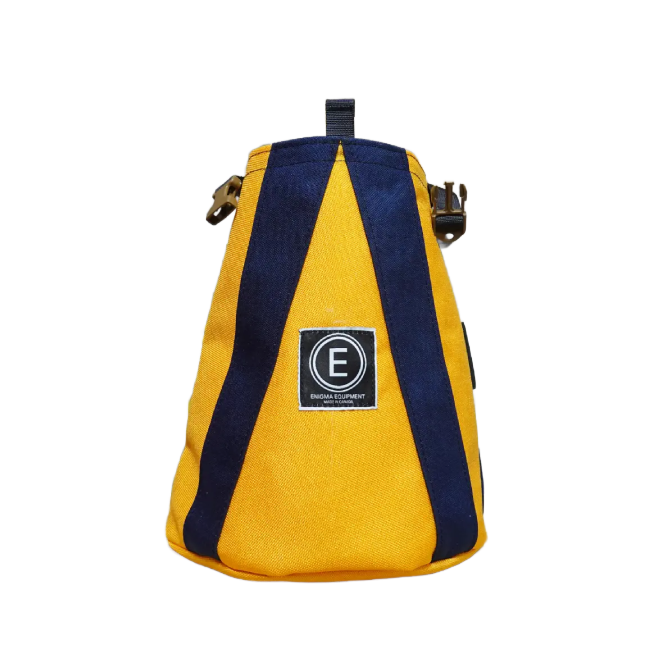 Enigma Equipement Apex Bouldering Bucket - durable and upright bouldering bucket, featuring a spacious main compartment, large zippered rear pocket, and three brush holders for all your climbing essentials.