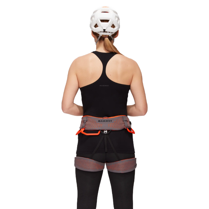 The Mammut Comfort Fast Adjust Harness Women is a climbing harness designed for comfort and ease of use. It features a women-specific fit, split webbing technology for even weight distribution, and a fast adjust system for quick leg loop adjustments. With durable construction, multiple gear loops, and safety features like a protected tie-in loop, it's ideal for all types of climbing.