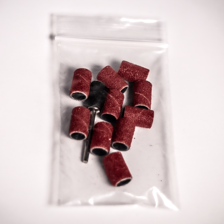 A pack of 25 sanding drums designed for the Grifter Electric Skin File, ideal for maintaining smooth skin during climbing.